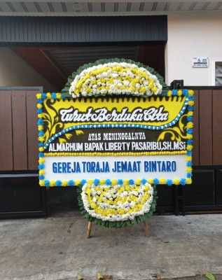 Papan Bunga Duka di Batang Serangan